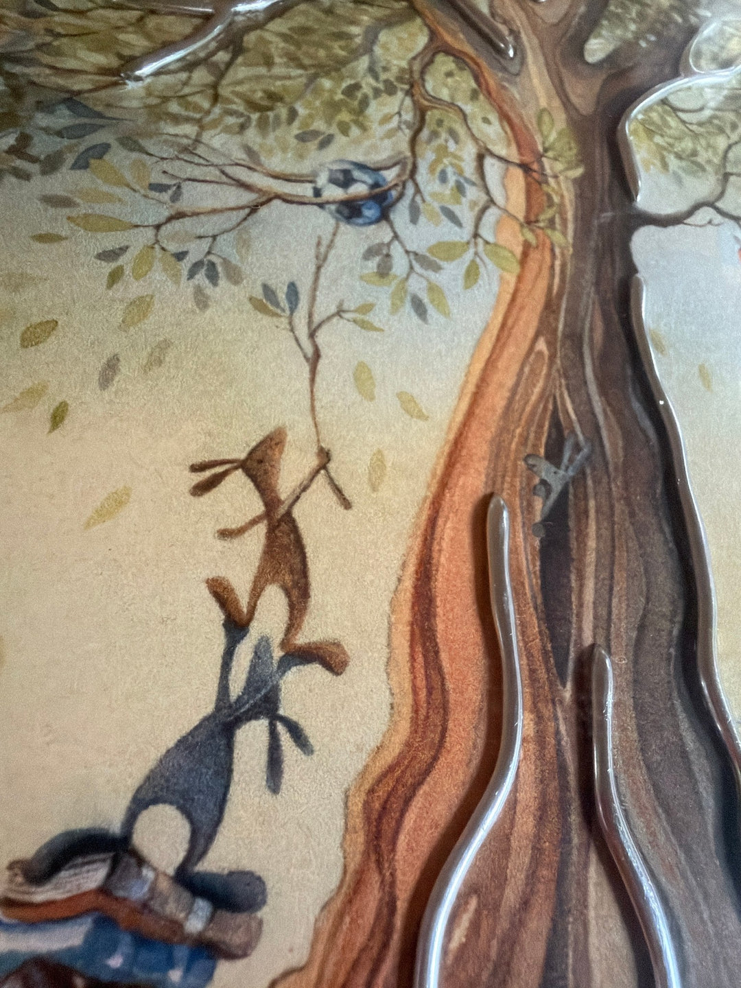 Carrot Cottage School by Catherine Stephenson – close-up of the hand-applied silver embellishments on the tree trunk, with hares climbing