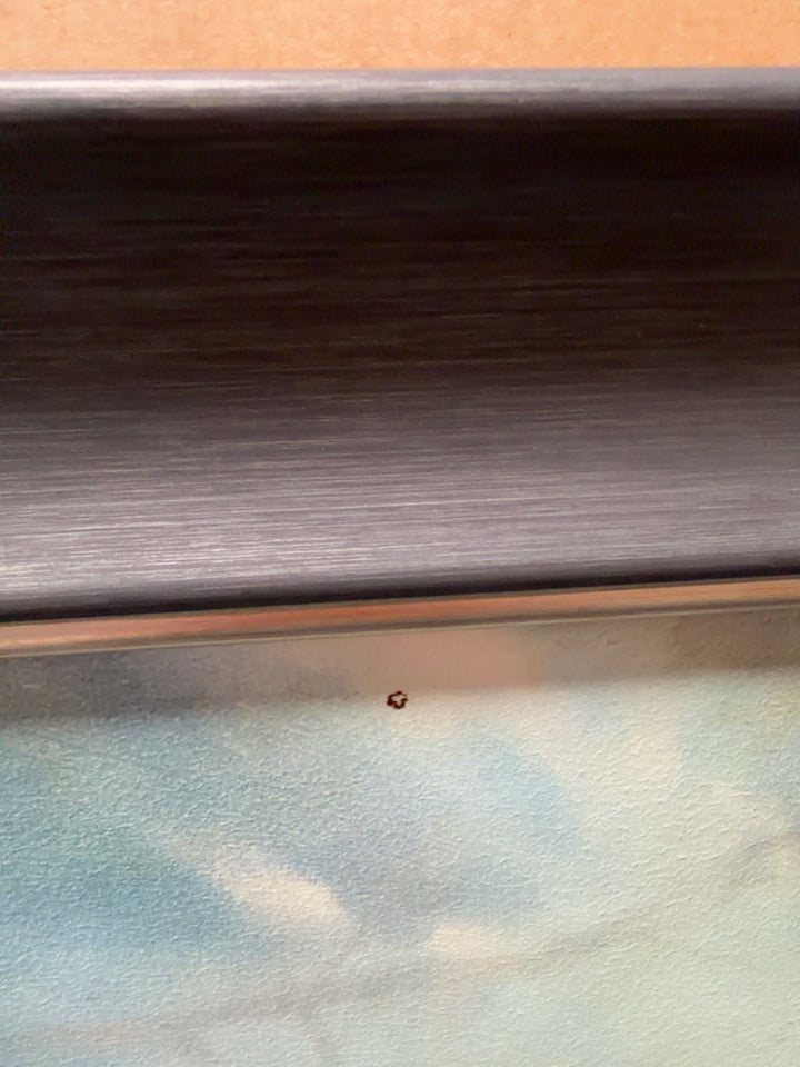 Close-up of small cosmetic mark - see pictures