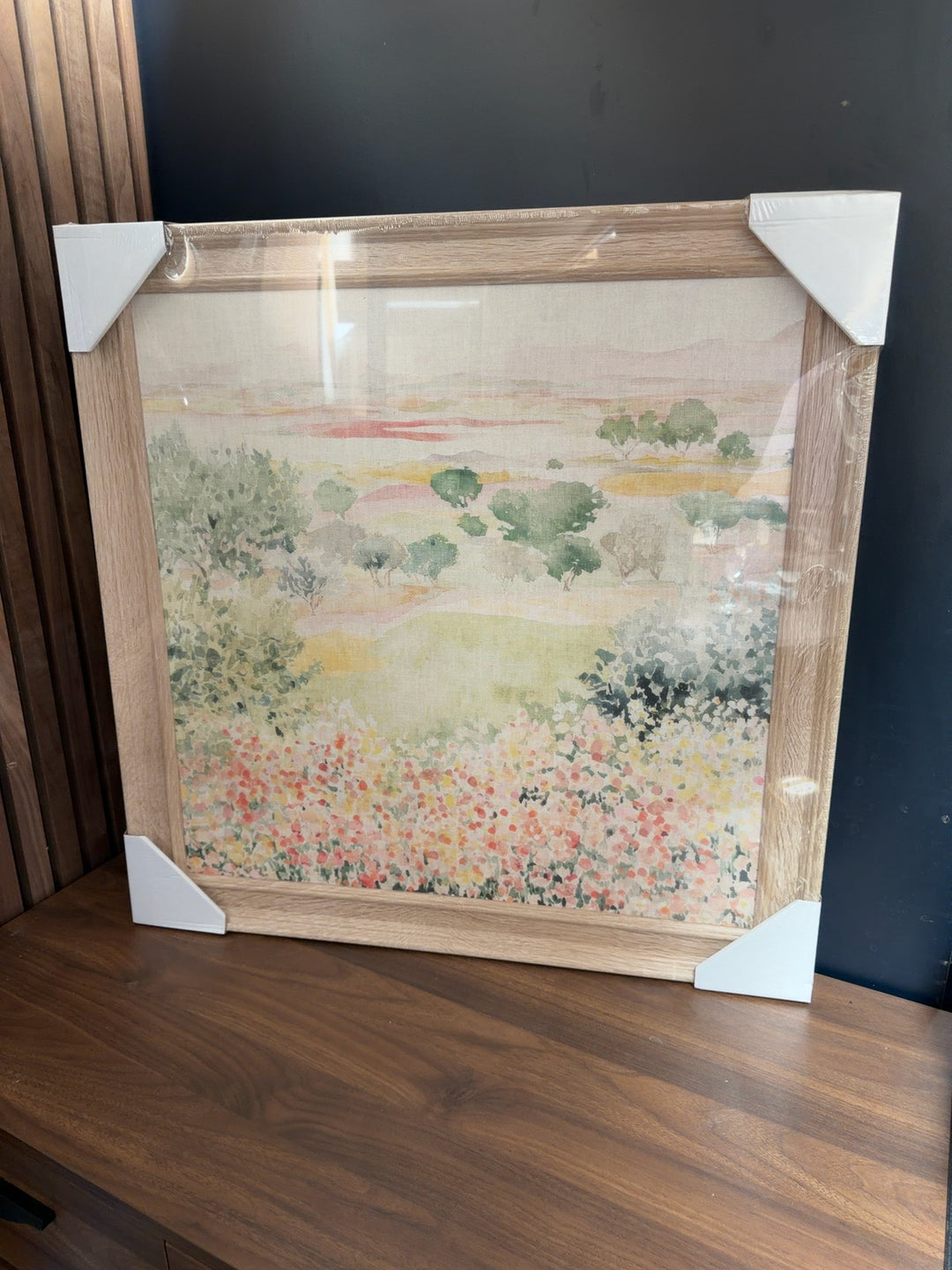 Meadow Fields trial artwork by T. J. Cardolia in a natural wood-effect frame